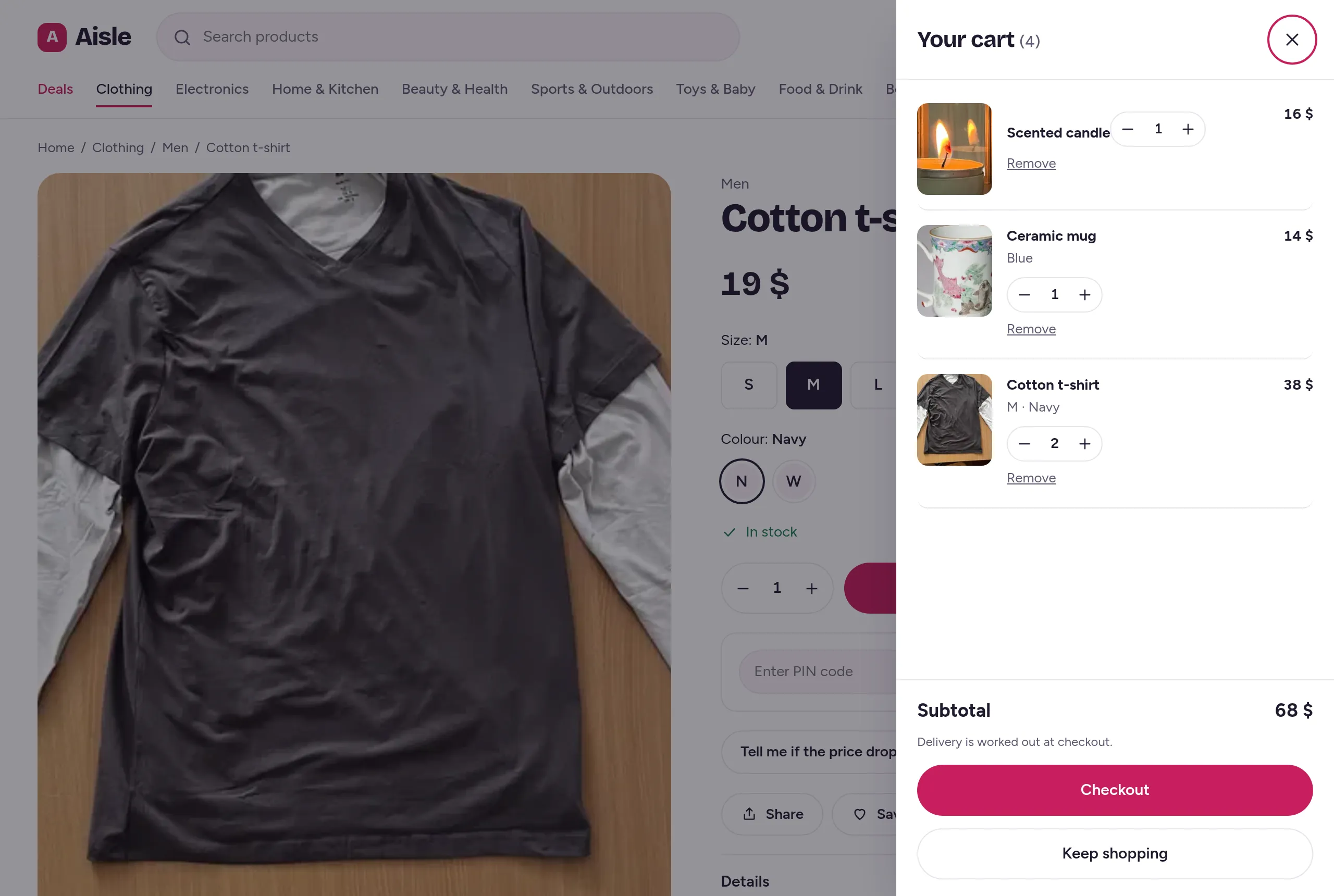 The cart drawer open over the product page, with a scented candle, a blue mug and two navy t-shirts in size M.